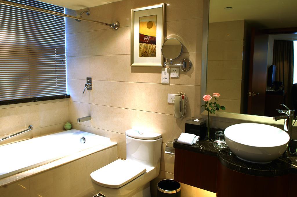 Merryland Traders Hotel Csangsu Szoba fotó